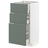 A white METOD kitchen cabinet with three mauve-gray drawers, featuring a modern and functional design.