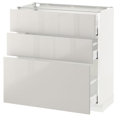 White METOD kitchen unit with 3 drawers, glossy finish.