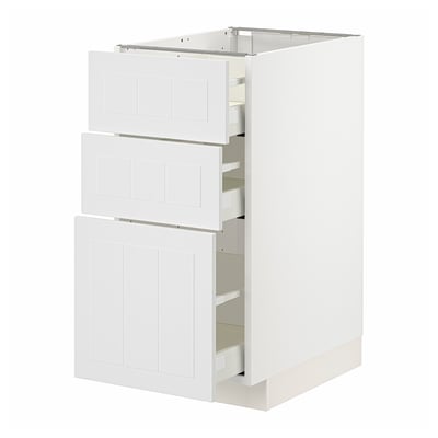 White METOD kitchen cabinet with three partially open drawers.