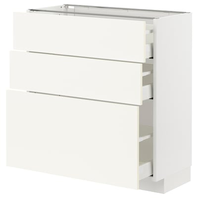 White METOD kitchen cabinet with three drawers and shelf.