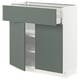 A modern IKEA METOD kitchen unit in grey-green and white with open shelves and drawers.
