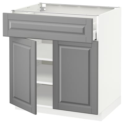 Gray METOD kitchen cabinet with opened doors and drawer. Traditional design, beveled edges, adjustable shelves, sturdy frame.