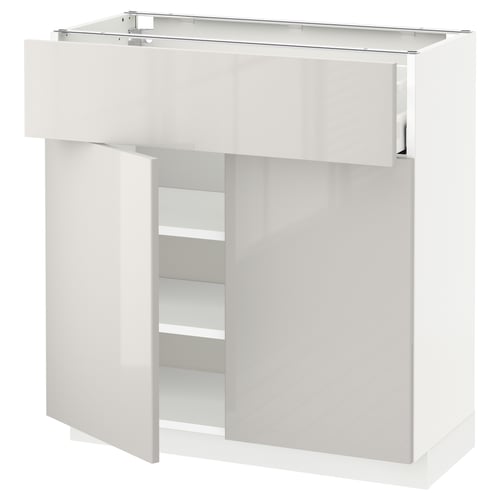 White modern cabinet with glass door. High gloss finish, adjustable shelves, and sleek design.