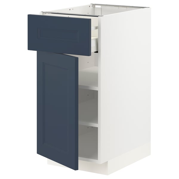 Modern kitchen cabinet, white & blue, plastic & wood, rectangular, with open drawer & shelf.