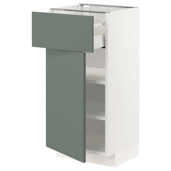 Modern kitchen unit: METOD in white with grey-green drawer. Sleek design, two adjustable shelves, and a smooth drawer.