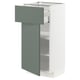 Modern kitchen unit: METOD in white with grey-green drawer. Sleek design, two adjustable shelves, and a smooth drawer.