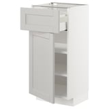 A white METOD kitchen cabinet with a drawer and three shelves.