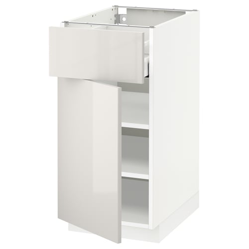 White ikea METOD kitchen cabinet with single door and drawer, adjustable shelf, reversible door, self-closing drawer.