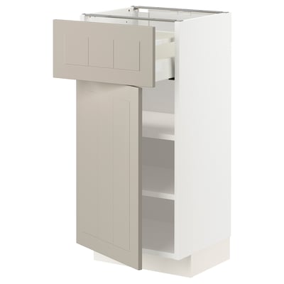Beige METOD kitchen cabinet, white base, open drawer, adjustable shelves.