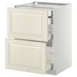 An off-white METOD base cabinet with two drawers. It has a traditional design with beveled edges and smooth-running drawers.