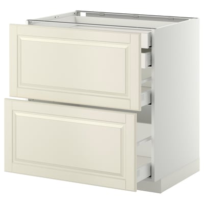 This image shows a white ikea METOD kitchen cabinet with four drawers, featuring a traditional design with off-white beveled edges.