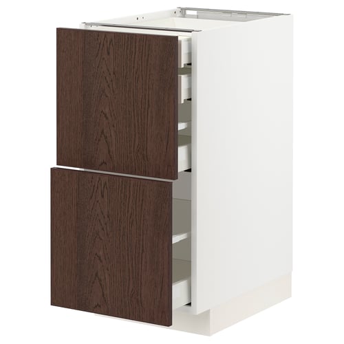 Dark brown wooden drawer front, white kitchen cabinet, modern design.