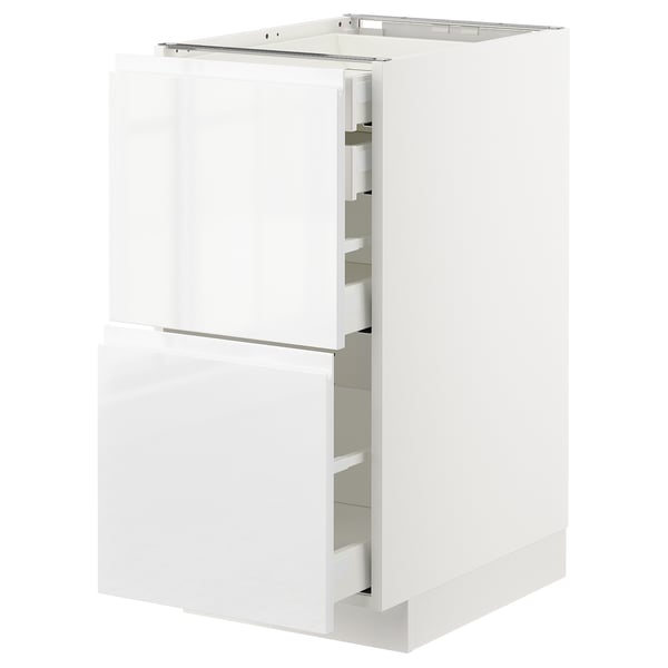 White glossy kitchen cabinet, rectangular, modern design with three drawers, sleek handles.