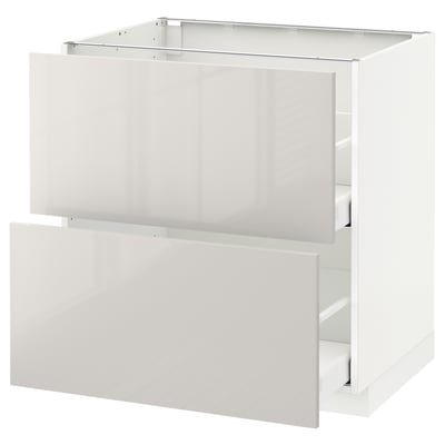 White modern kitchen cabinet with glossy finish and smooth drawers.