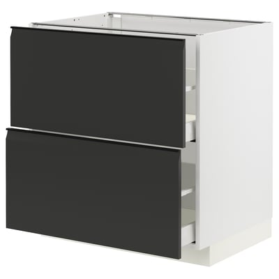 Modern black kitchen drawer set with sleek handles and glossy finish.