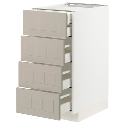 METOD kitchen unit with beige drawer fronts. Four drawers, white cabinet frame, sleek modern design.