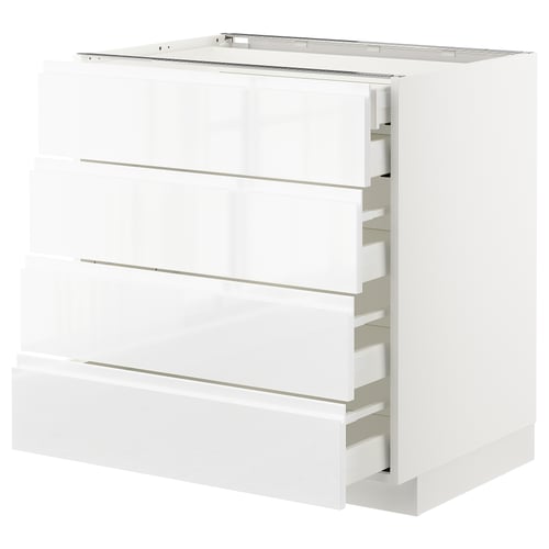 A white METOD kitchen cabinet with three drawers and a shelf on top. The cabinet has a sleek, modern design with integrated handles.