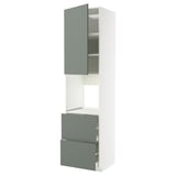 Modern white kitchen unit with grey-green drawers, combining storage and design for a sleek look.