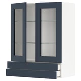 Blue glass-door kitchen cabinet from ikeas METOD series, featuring three shelves and adjustable positioning.
