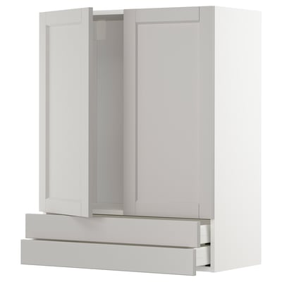 White METOD kitchen cabinet with pull-out drawers and two doors.