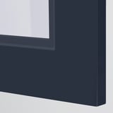 Close-up of modern blue glass cabinet door; sleek design, sturdy frame, smooth finish.