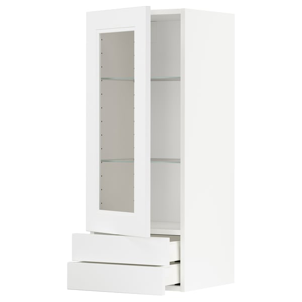 White METOD kitchen cabinet with glass door and three drawers.