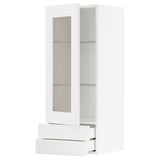 White METOD kitchen cabinet with glass door and three drawers.