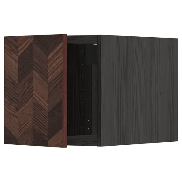 A dark, modern cabinet with a herringbone wood pattern and a left-side hinge door from the METOD kitchen series.