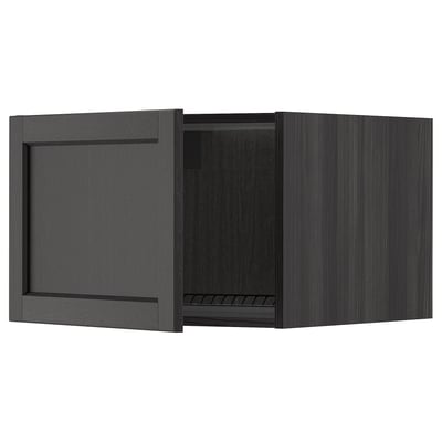 Black wooden kitchen cabinet, dark stained ash with beveled edges, single door open showcasing interior shelf.