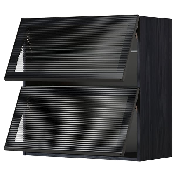 Black METOD kitchen unit, sleek with textured glass doors, modern design.