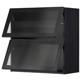 Black METOD kitchen unit, sleek with textured glass doors, modern design.
