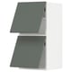 Modern kitchen cabinet, grey-green, two doors open to show shelves, fashionable minimalist design.