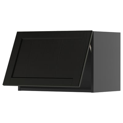Black kitchen cabinet with beveled edges, sleek design.
