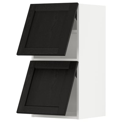 Black stained wooden cabinet doors with beveled edges.