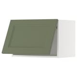 Green kitchen cabinet with modern design.