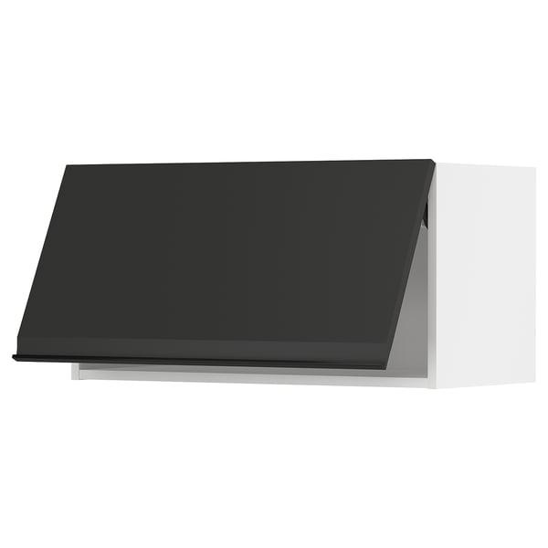 Modern black kitchen cabinet with sleek handle, angled design.