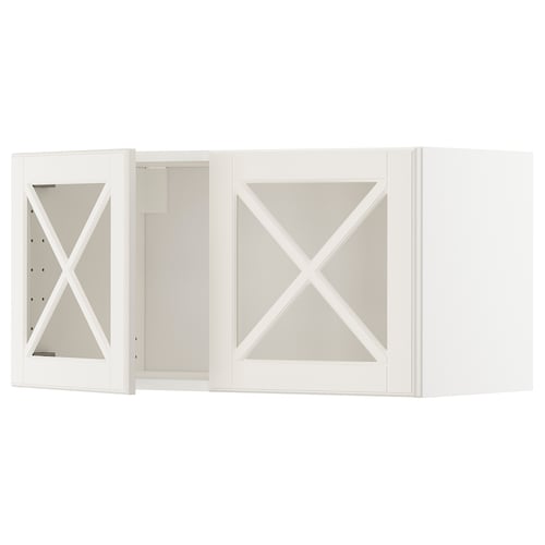 A white METOD kitchen cabinet with bodbyn glass doors, featuring a traditional design with bevelled edges and a warm feel.