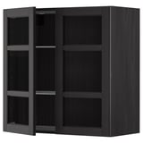 Black stained wooden kitchen cabinet with adjustable shelves and open door.