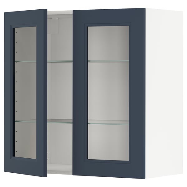 An open, dark blue wall cabinet. The cabinet has glass shelves.