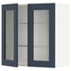 An open, dark blue wall cabinet. The cabinet has glass shelves.