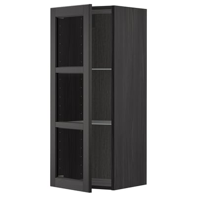 An open black wooden cabinet with three glass shelves, part of the METOD kitchen system.
