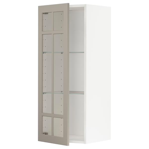 An open, beige METOD wall cabinet with glass shelves.