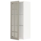 An open, beige METOD wall cabinet with glass shelves.