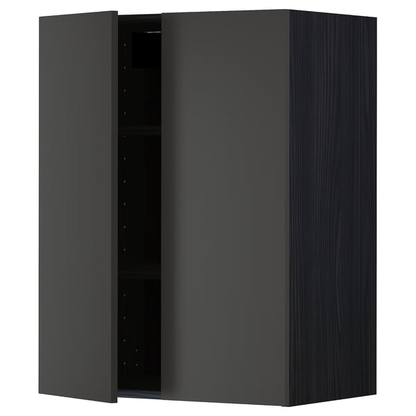 A dark grey METOD kitchen cabinet with a wooden grain design and a single open door revealing shelving and adjustable pins.