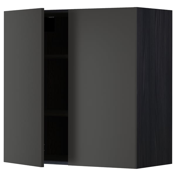 A modern black METOD wall cabinet with one open door, revealing an empty shelf inside.