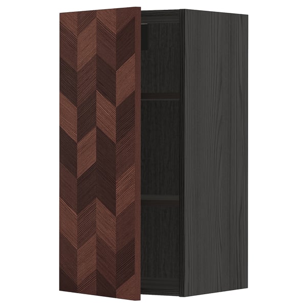 A brown herringbone-patterned kitchen cabinet with a dark frame, featuring a single shelf inside.