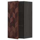 A brown herringbone-patterned kitchen cabinet with a dark frame, featuring a single shelf inside.