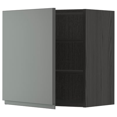 Modern grey kitchen cabinet with dark wood grain texture, one door open revealing two shelves.