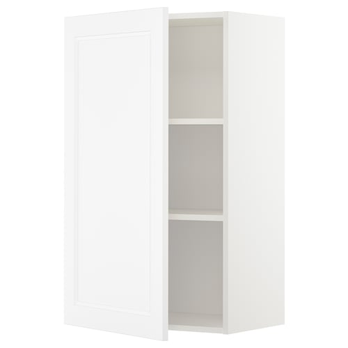 A white METOD kitchen cabinet with a door and adjustable shelf. Its rectangular and a simple, modern design.