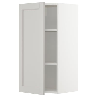 A METOD wall cabinet in white with two adjustable shelves and beveled edges.